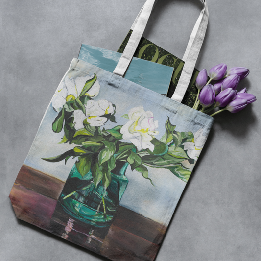 Tote bag with floral design on a gray surface